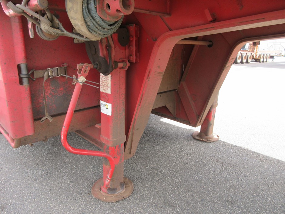 Rash Vest Made With Water Reactive Fabric Showing Dolphin Print When Wet