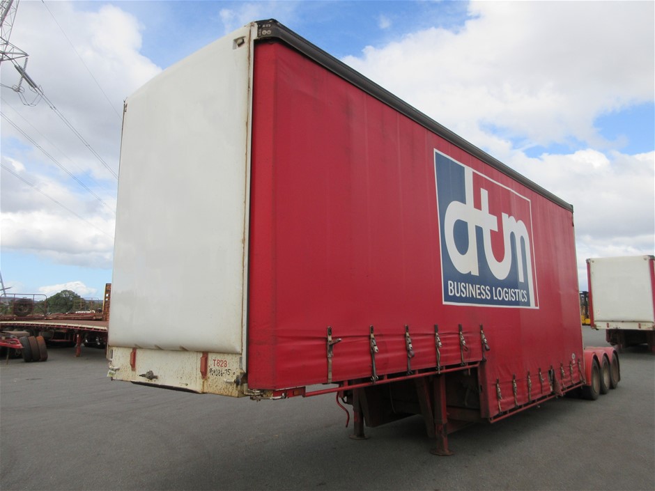 Rash Vest Made With Water Reactive Fabric Showing Dolphin Print When Wet