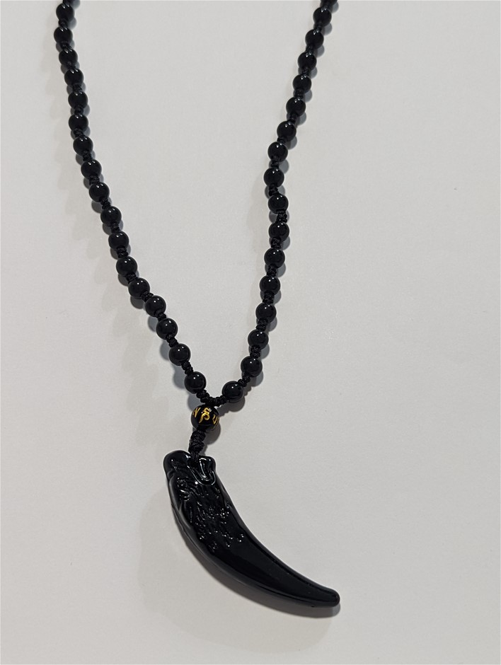 Black tooth pendant necklace Auction (00012545188) Grays Australia