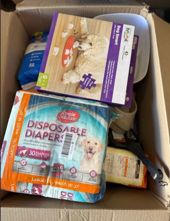 Mixed Pet Supplies Box- A mixed assortment of pet care products including d