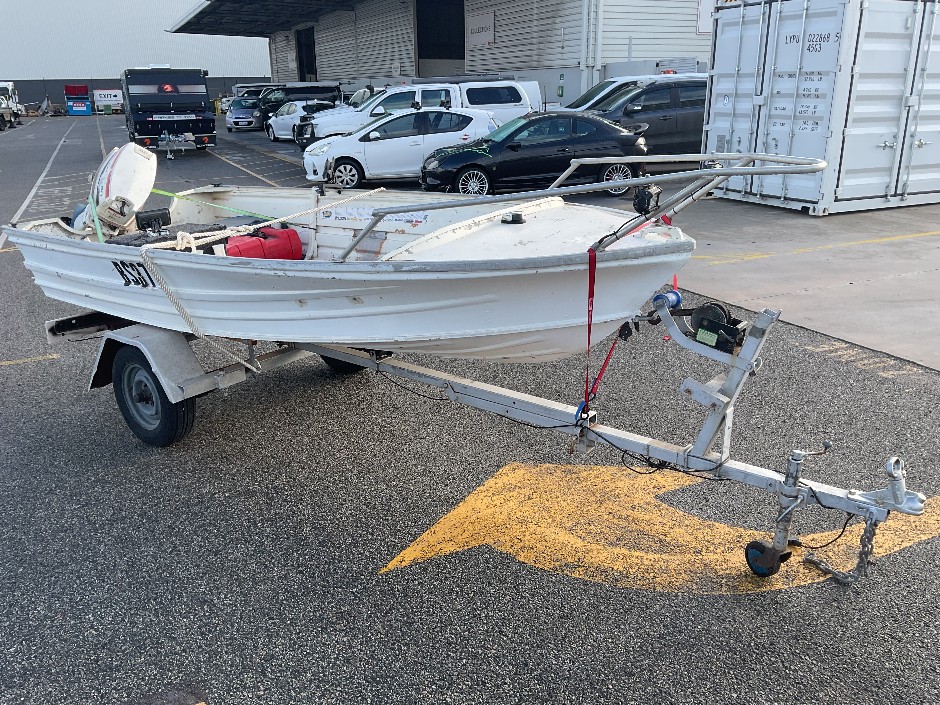 <p>1975  Tinnie Boat and Trailer</p>