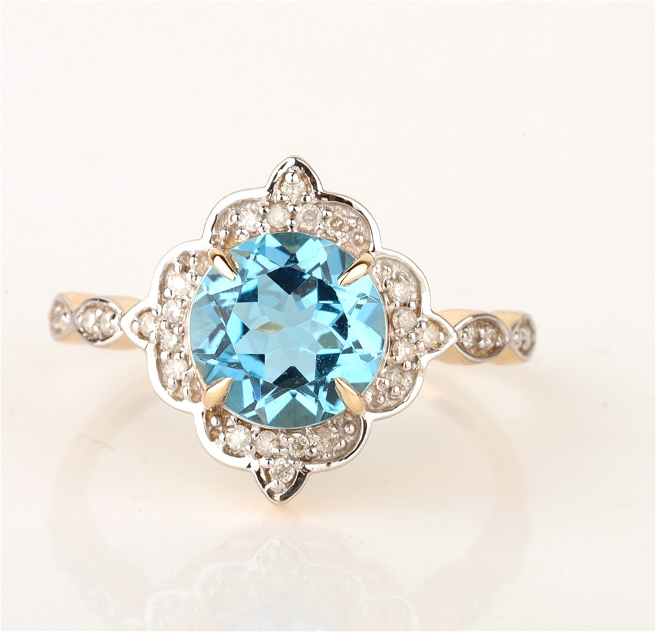 <b>9ct Yellow Gold Natural Swiss Blue Topaz & Diamond Ring