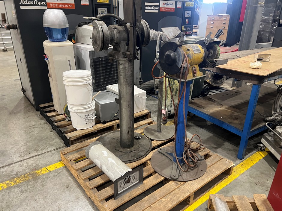 Pallet comprising of standing Grinders and steel stands.