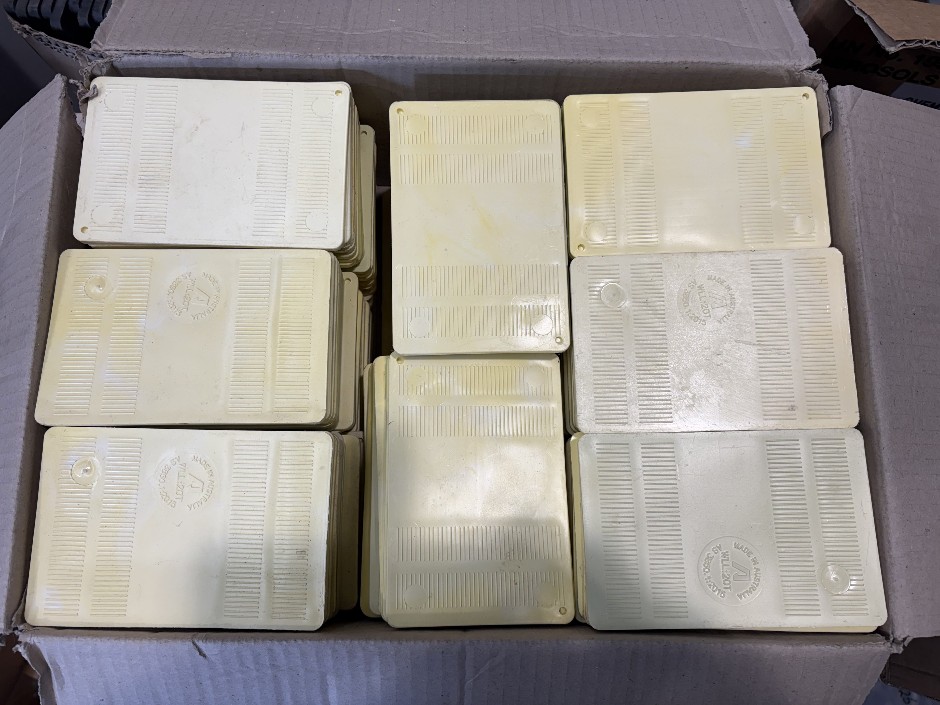 Pallet comprising unused large qty of plastic packers in various sizes