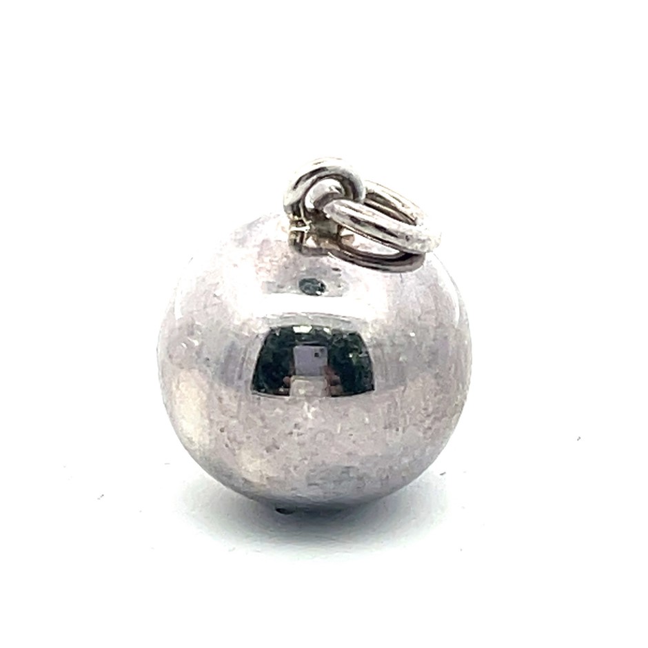 A sterling silver spherical bell pendant featuring a polished hollow orb