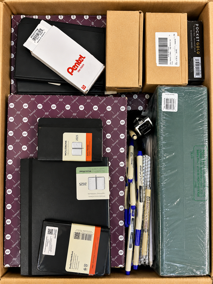 BOX OF ASSORTED BRANDED STATIONERY: Moleskine 2025 Planners, Pentel Pens, S