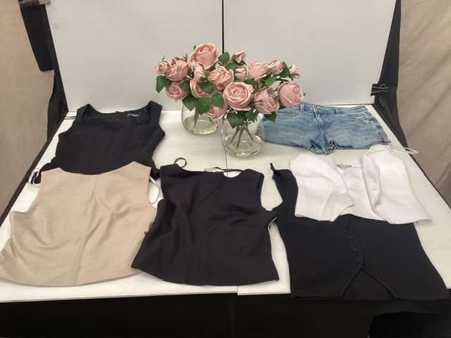 Assorted Clothing And Flowers