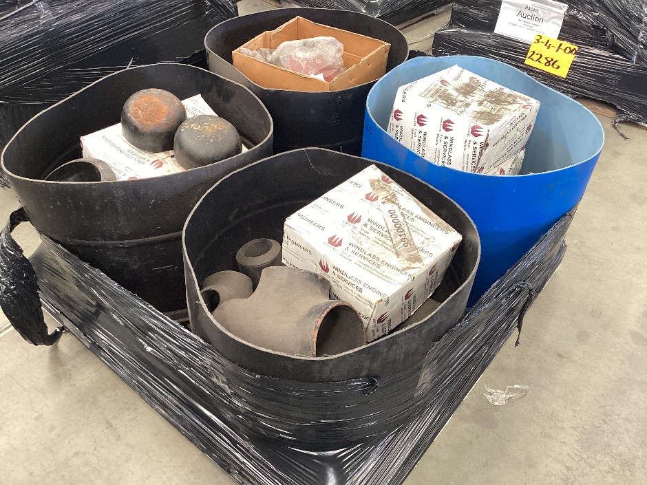 <p>Pallet containing assorted pipe fittings and flanges</p>