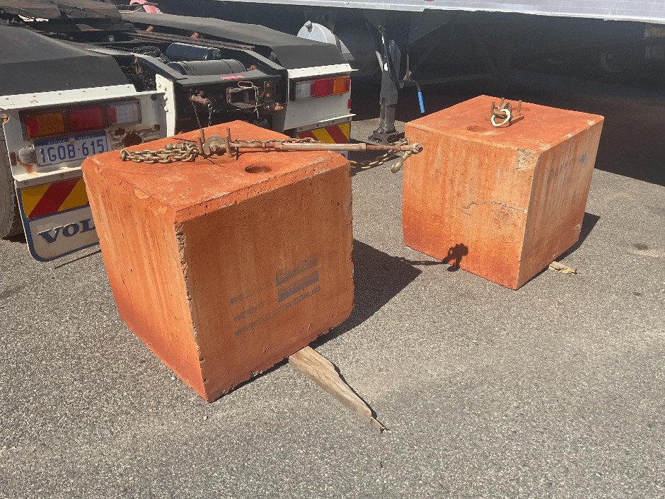 <p>Two Concrete Cyclone Blocks</p>