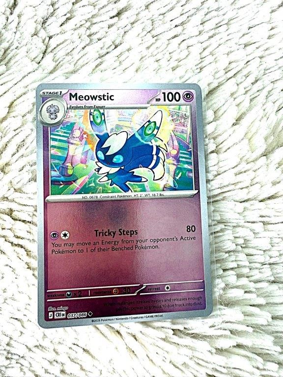 Meowstic holo card featuring the Psychic-type Pokémon in colourful artwork.