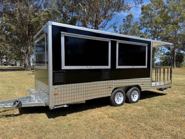 <p>2026 Dual Axle Enclosed 740 Food Trailer with Porch (Unused) - Black</p>