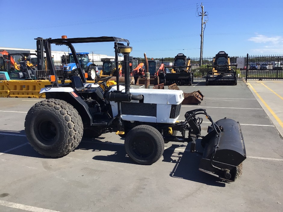 <p>Tractor with Sweeper Attachment</p>