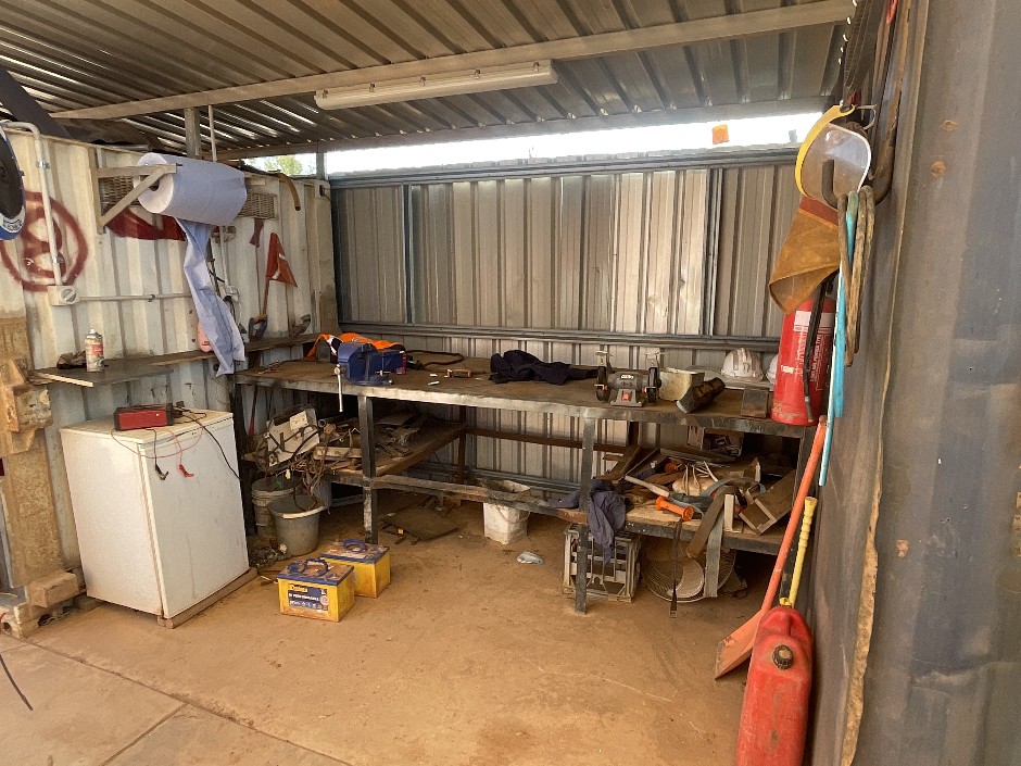 Workbench and Assorted Belts. batteries and Tools